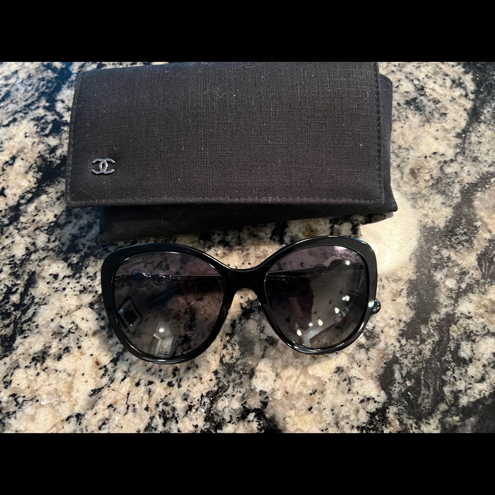 Like new Chanel sunglasses with side pearl detail.